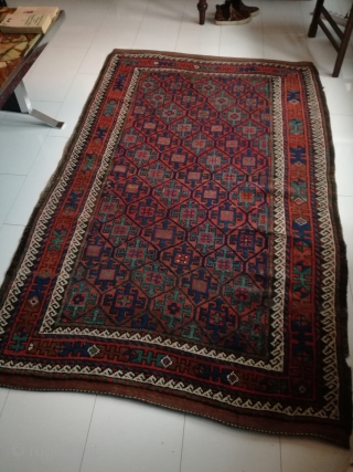 An antique Baluch with 218/135 cm. Good shape with few demages.                      