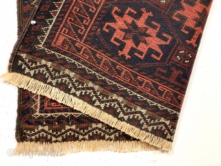 Antique blue ground Baluch rug with an unusual long narrow size, all over tile design and rare piled ends or skirt panels. All natural colors. Overall low pile with considerable oxidized browns.  ...