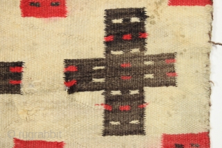 Antique Navajo weaving with intriguing design. So called "pound" rug or blanket. Crude, thick weave. Natural wool colors and characteristic red. Dirty and with end damage as shown. Late 19th c. 4'2" ...