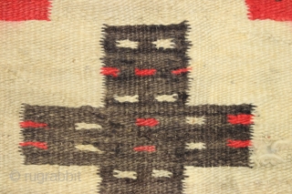 Antique Navajo weaving with intriguing design. So called "pound" rug or blanket. Crude, thick weave. Natural wool colors and characteristic red. Dirty and with end damage as shown. Late 19th c. 4'2" ...