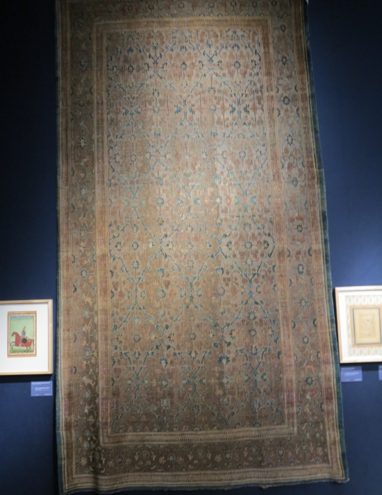 A silk and metal-thread Khotan carpet, lot 124