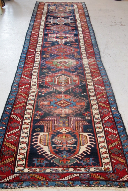 Just in! 19th century North-west Persian runner. 4.00m x 1.05m  (13' x 3'6"). Really good colours, and strong design. Archaic drawing of the medallions. Note also how each medallion is different!  ...