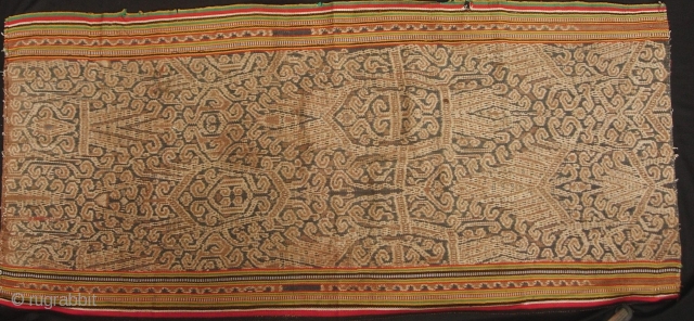 Good Iban woman’s kain depicting tree of life with bamboo running the length of the bidang reaching above the forest canopy, circa 1950s. Aside from commercial warp thread on sides, it is  ...