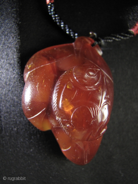 Lovely Qing Dynasty pendant of a monkey on a leaf, “staring at the moon”, carved from carnelian. An unusually fat piece with a rich dark color rarely seen in Chinese carnelian. L:  ...