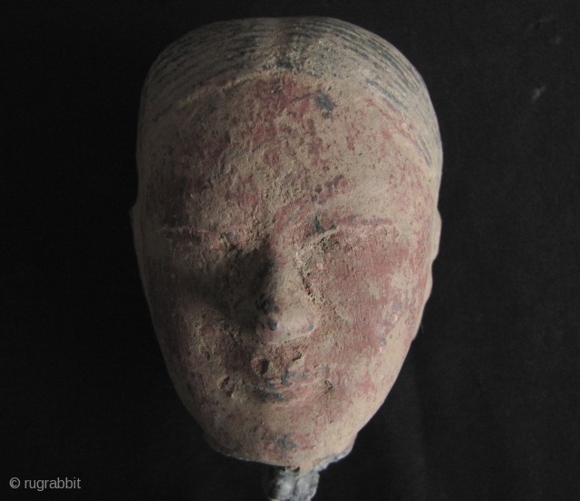 Han Dynasty pottery head of a female court attendant.  A lovely face with sensitive features, original red pigments on face, this image embodies the most classic style of Han sculpture. There  ...