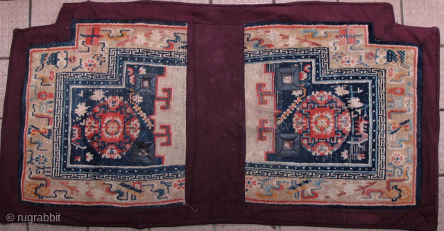 Early 20th century Tibetan saddle rug with traditional maroon colored border and backing. I bought this in Zhongdian (aka Shangri-la, Yunnan), over 20 years ago. Some worn areas (please note enlargements) and  ...