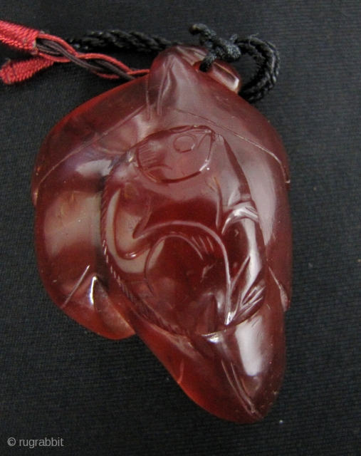 Lovely Qing Dynasty pendant of a monkey on a leaf, “staring at the moon”, carved from carnelian. An unusually fat piece with a rich dark color rarely seen in Chinese carnelian. L:  ...