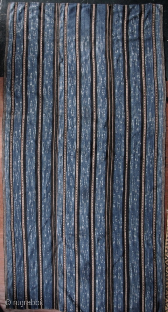 China: Exceptionally fine and rare three paneled ikat blanket from the Li people of Hainan Island, Southwest China. The lighter wide indigo bands consists of a coarse warp fiber most likely linen  ...