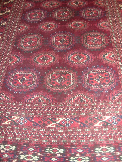 Beautuful saryk turkman carpet,  6'8''x10'10'' great condition, it was sent from Turkmenistan. The guls seem to float on the maroon field           