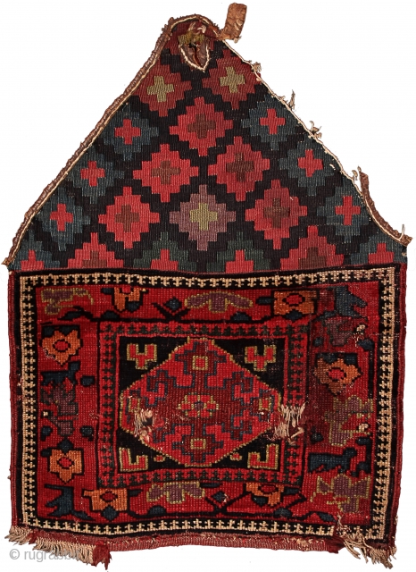 Pile khorjin recycled as saddle rug
Kurds of the Sauj Bulagh area
Northwest Persia
Circa 1850
63 x 43 cm (25 x 17 in.) 

Weaving Density:	10 H x 8 V = 80 kpsi.
Colours:	maroon, pinkish red, apricot,  ...