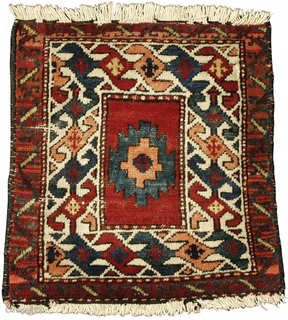 Pile khorjin face, Shahsavan Confederacy. Northwest Persia, Circa 1880, 48 x 45 cm (19 x 17.5 in.) 

Knot count:	13 H x 15 V = 195 kpsi.
Colours:	red, peach, blue, yellow, blue-green, dark brown,  ...