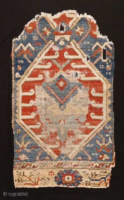 Rare and beautiful fragment of a 17th/18th century Karapinar rug with directional palmettes and stylised tulips, Central Anatolia. An example with this pattern is in the Al-Sabah Collection, Kuwait National Museum and  ...