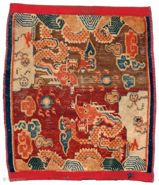 http://rugrabbit.com/content/hunting-and-gathering-china-tibet-and-east-turkestan     

Part of our online exhibition, "Hunting and Gathering: China, Tibet, and East Turkestan" 

Small rug with dragons
Tibet
Circa 1900
76 x 63 cm (30 x 25 in.) 

Knot count:	11  ...