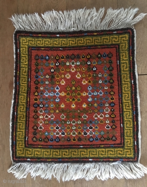 Unusual Tibetan (Mongolian?) seat cover with Stupa-motif. Wool on wool, natural colors, very thin weft. Slightly tapering left side. Perfect original condition. Size 18.9 x 18.5 inch (48 x 47 cm).  