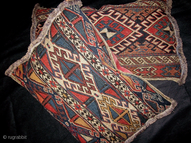 A Gorgeous Pair of Antique Shahsavan Flat weave cushions, made from 19th Century Shahsavan soumak mafrash panels. Each piece has a different design; both designs are graphic and engaging. The colours are  ...