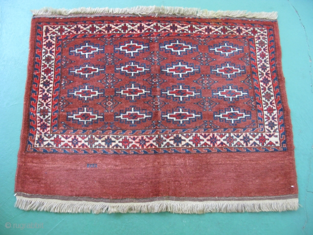 Antique Yomud chuval, bag face, hand knotted wool, Turkmenistan, ca. 1900, strong condition with sides and end finishes intact, some staining, red color run, the approximate size is 32 inches x 44  ...