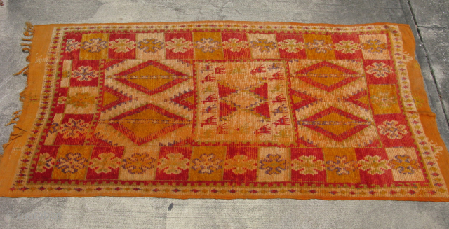 Semi-Antique Moroccan rug, hand knotted wool, ca 1950's, orange and red with pale purple, green, yellow, I love the square central medallion surrounded by animals that look like camels to me, Worn  ...