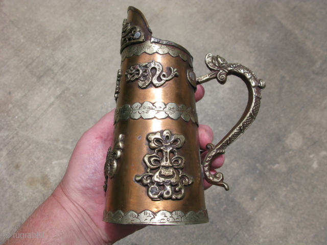 Vintage Tibetan pitcher, hand crafted copper and silver colored metal, 7 applied water dragons and a dragon as a handle, signs of use on the inside, some tarnish, corrosion to the bottom,  ...