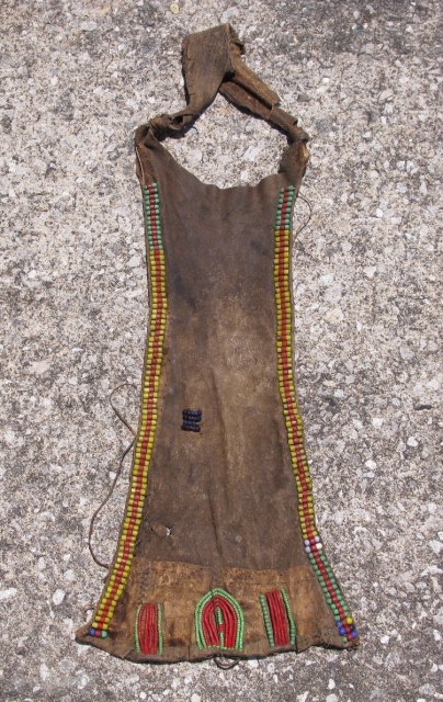 Old African modesty apron, cache sexe, for a young girl, Turkana People of Kenya, hand embroidered glass beads on hide, sinew sewn and sewn with hide strips, soiling, stiffness of hide due  ...