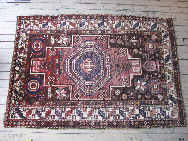 Antique Konaghend Caucasian rug, hand knotted wool on a wool foundation, Caucasus Mountains, Azerbaijan, there is a small prayer niche at the bottom, human and animal figures, signed "Aranna" on one side,  ...