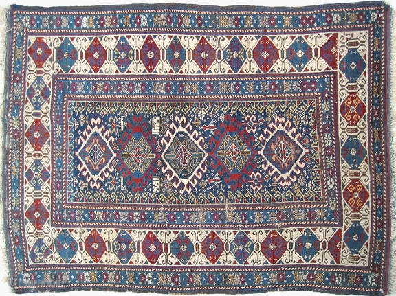 Antique Baku rug, hand knotted wool, Eastern Caucasus, the date 1308 is woven into the rug, 1890 in our calendar, general good condition, small areas of wear and one corner is frayed,  ...