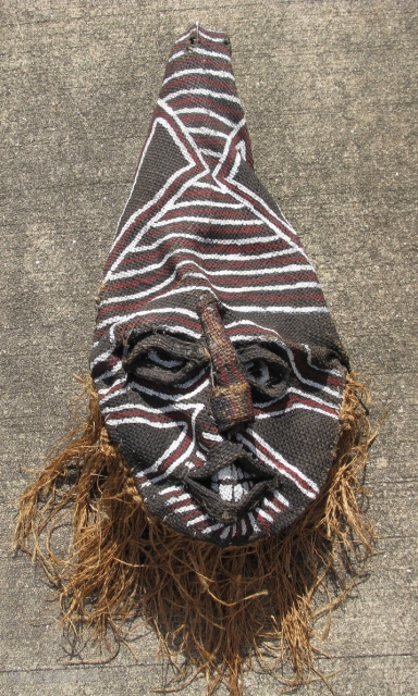 Vintage African Makishi dancer mask, Zambia, Chokwe People?, hand woven raffia with raised relief, on a metal frame, hand painted, some missing raffia, it is flattened, the tip of the top is  ...