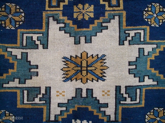 An unusual Lesghi rug with Chichi borders. Circa 1900, size 6'x3'10" [117cm x 183cm]. All wool. Excellent condition, original sides, and a nice floppy handle. 
       