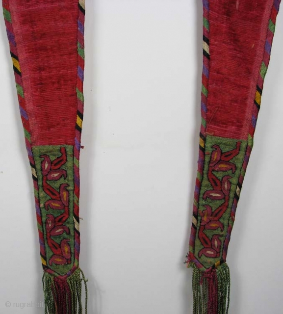 Turkmen false sleeves, silk embroidery with handmade velvet, late 19th/early 20th century, 45" long (including fringe) x 5.5"               