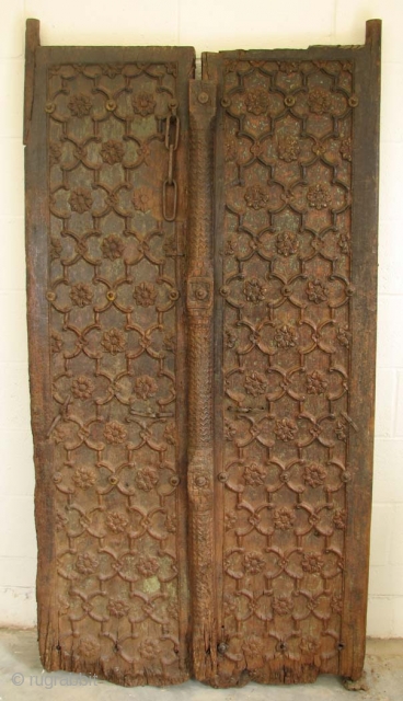  WOOD002  Mughal Wood Door, Pakistan, 18th Century, 66" (not including hinge poles) x 35.25, Part of bottom  missing.  Very heavy!         