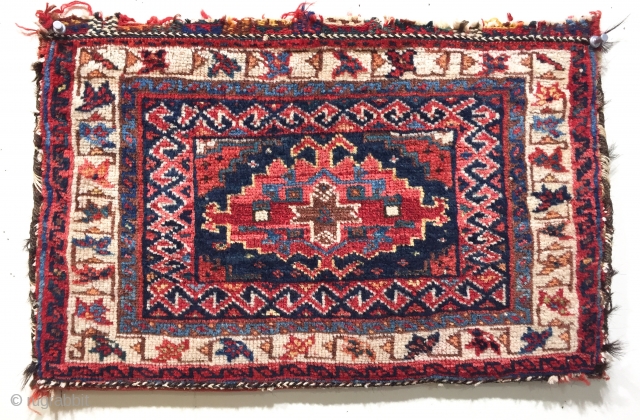 lovely antique Afshar bag with saturated natural dyes and unusual back size 48 x 30 cm dating from the late 19C.
Original abrashed red kelim back, half of original fastenings at top intact.
Just  ...