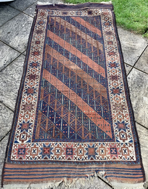 Interesting antique symmetrically knotted Baluch rug that just arrived.  Unusual “tobacco “ star border great graphics in the field 7 ft 7 x 3 ft 10 old tent carpet size. Ca  ...