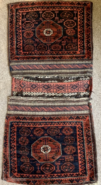 Lovely antique Baluch complete khorjin. Very good condition all wool and natural dyes great bridge in centre and intricate flat woven back.           