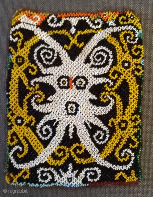 Beadwork Borneo

part of a Baby carrier, old and very fine work in best condition.

size: 17cm x 14cm                