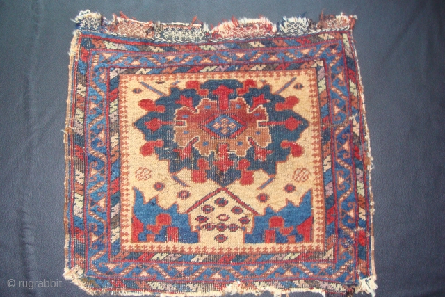 An Old Afshar bagface with a unique design on a unusual light camel background. The designs remind me of the Ningshia wave at the bottom with a Turkish Smyrna medallion. 23inches x  ...