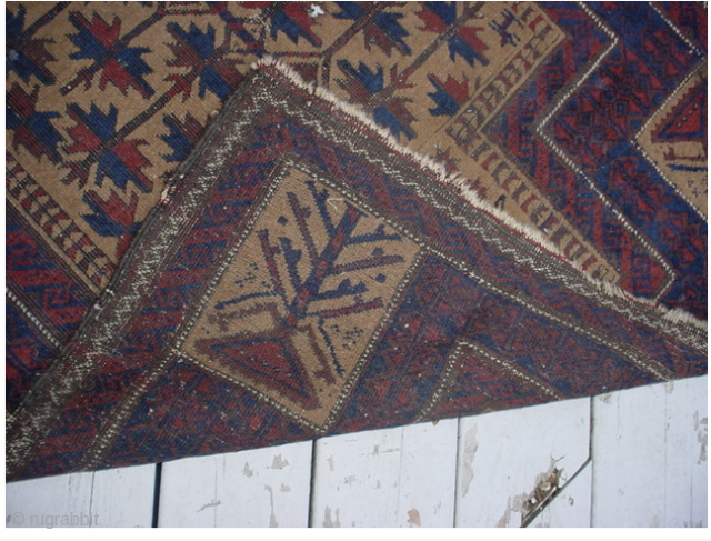 Very early Baluch prayer rug containing an unusual archaic design.                       