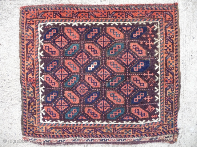  SOLD A pretty 19th cent. Balouch group (Aimac?)bagface with an aubergine ground,turquoise blue and apricot orange colours. Good pile and condition, 2ft1in x 1ft10in    SOLD    