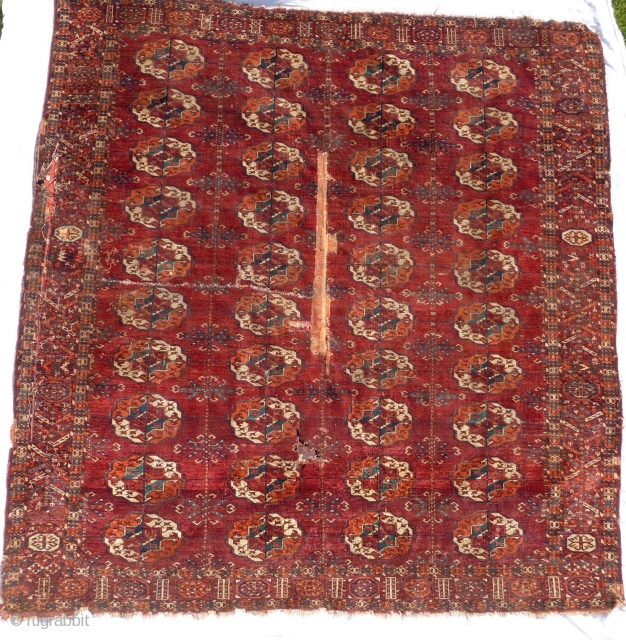  SOLD  Tekke Turkman Main Carpet: 18th cent.: 6ft8ins x 6ft5ins

An exceptionally beautiful and rare carpet with a decorated tree border, thin dry parchment handle, turquoise green, complete and in "as  ...