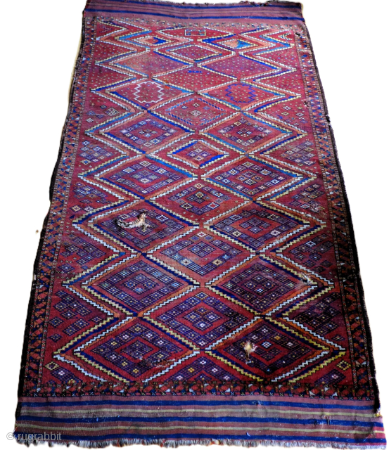 A 19th century Beshir Main Carpet. Size 278 x 144cms including kilim ends.

An eccentric freehand diamond lattice design, with an Uzbek flavour, on a brick red field in overall reasonable condition.   ...