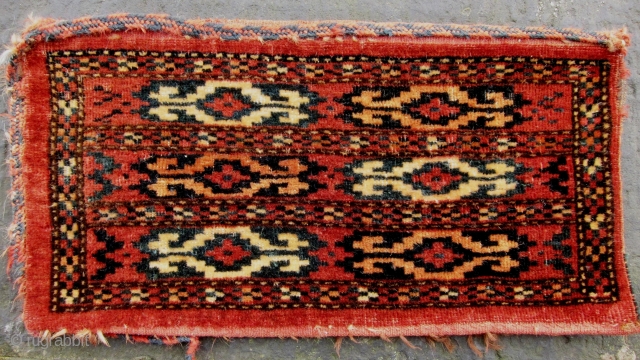 19th Century Yomut Spindle Bag. 

Size 54 x 27 cm (pile face only)

With remnants of decorative platted selvedge chord. Red flatwoven back intact, Pile pretty good. Photos taken outside.    
