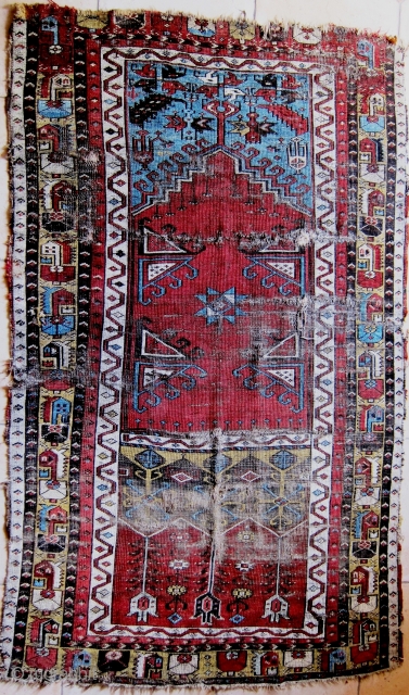 A 19th Century Ladik Prayer Rug 
 Size 184 x 114 cm
A fragmented Ladik prayer rug in poor original condition, losses to selvedges and both ends, with good colours, very soft handle,  ...