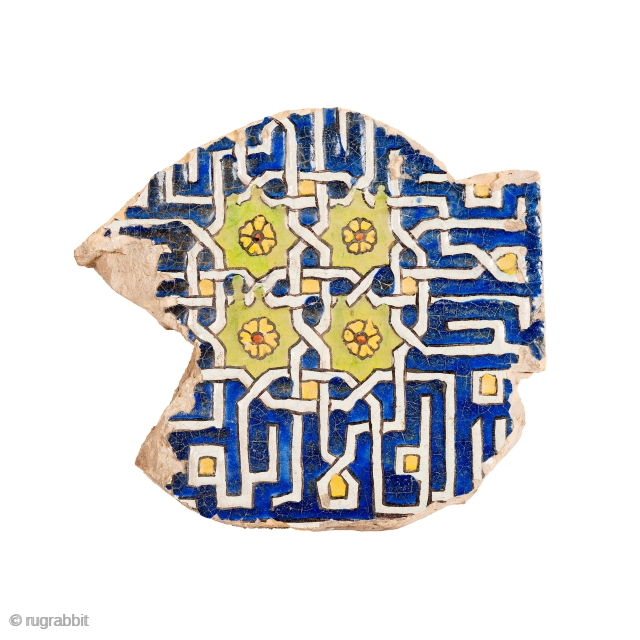 A large fragment of Timurid cuerda seca pottery tile, decorated with four identical interlocking decorative inscriptions in square Kufic, لا إله إلا الله, the beginning of the shahada, ‘There is no god  ...