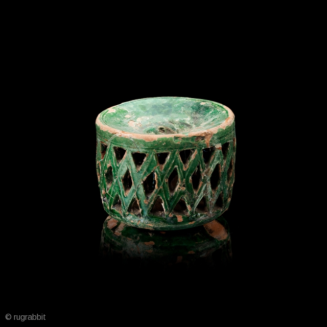 Inkwell, cylindrical form, slip-painted, carved and moulded decoration, green glaze.
Samarkand, 10th century
H. 6.7 cm; Diam. 8.4 cm
Published: Arts from the Land of Timur. An Exhibition from a Scottish Private Collection. Paisley, Sogdiana  ...