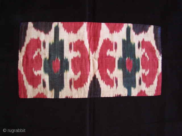 Silk Ikat fragment .
on black backing.

late 19th century.
fragment 40x20cm.                        