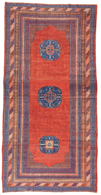 Lot 68, Khotan, 12 ft. 2 in. x 6 ft. 1 in., Eastern Turkestan, ca. 1800, Condition: good according to age, pile partly low, few small repairs and reweavings, Warp: cotton, weft:  ...