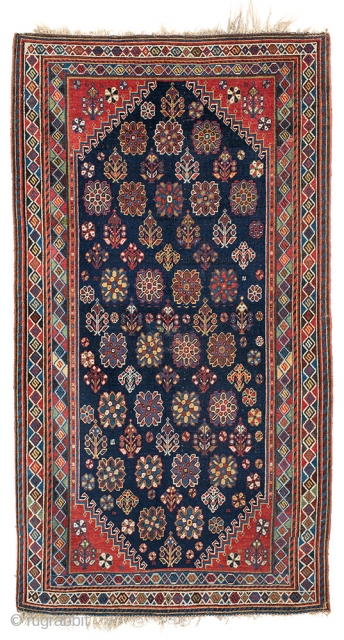 Antique Qashqai mihrab rug with flowering plant and star-shaped blossom motifs on a midnight blue ground, probably Shekarlu tribe. ~1890-1900. 107x195cm (3'6"x6'4"). Good overall condition, some repairs, original finishes all around. All  ...