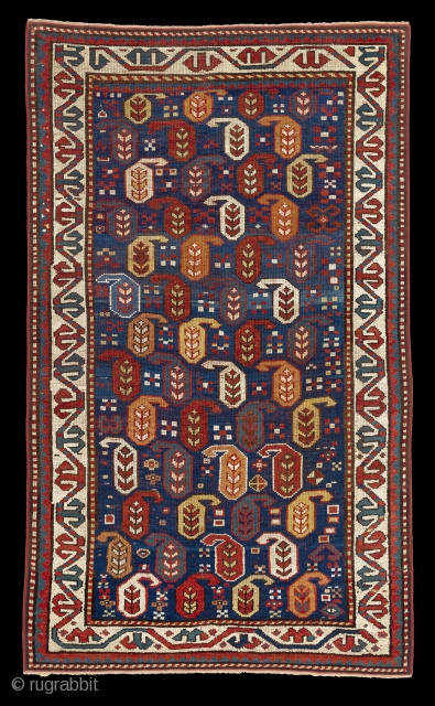 Antique Kazak rug in an indigo blue ground with polychrome boteh / buta motifs.  ~1880-90. 102x170cm (3'4"x5'6"). Rare natural colors which can not be seen in late examples - apricot, emerald  ...