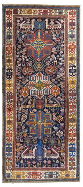 Antique Shirvan "Akstafa" bird/peacocks rug, ~1870. Size: 117x260cm (3'10"x8'6"). The dark blue indigo field with three blue, ivory and red octagonal star medallions, each containing different motifs such as hooked swastika, diamond  ...