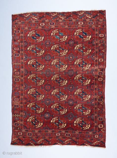 An early Tekke wedding? rug with great color and a fine weave. Beautiful spacing in the field design and a bevy of interesting devices in the border. Missing a bit on each  ...