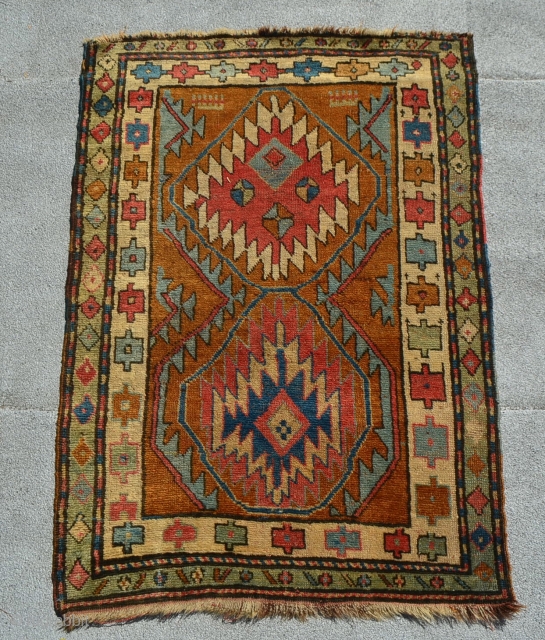 A unique Northwest Persian? Kurdish? rug with very appealing bold and archaic design elements. 4'7" x 3'2". 

               