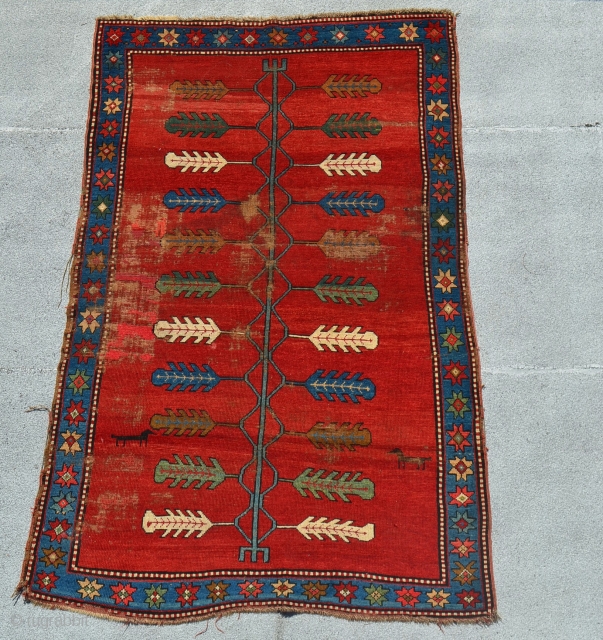 Kazak. 19th century.  Areas of wear and some repiling. 

6'8" x 4'3".                    